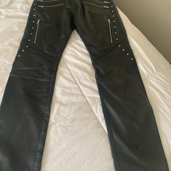 Diesel Leather Pants Mens with front and back pockets with zippers on them.